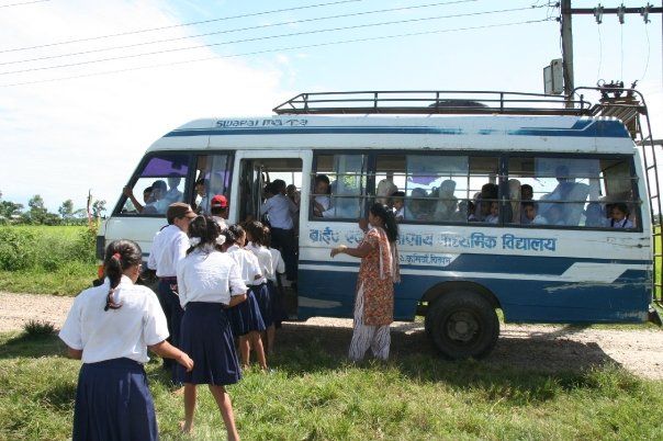 A pupil with the school transport that connects remote villages with the school