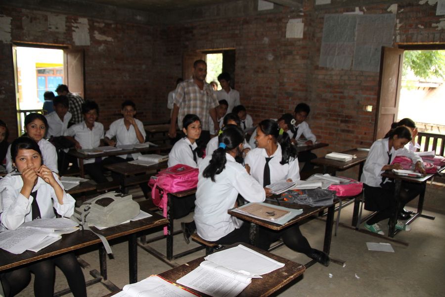 Pupils in uniform studying in the classroom